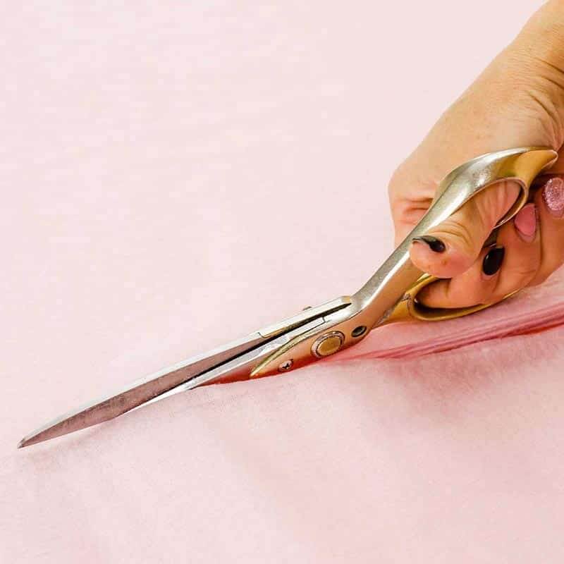COURSES-featured-fashion-design-p1-sq Womans hand cutting fabric after completing the Successful Fashion Design and Dressmaking course