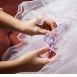 Close up of hands making a dress after taking Professional Fashion Design and Dressmaking course