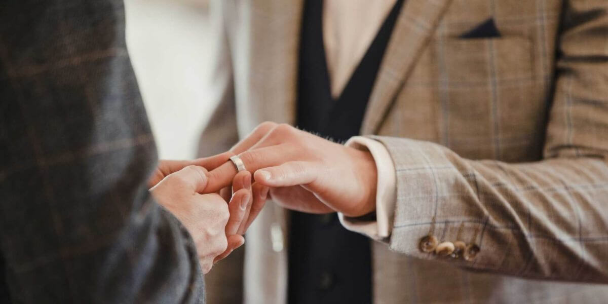 close of hands during a civil wedding held by someone who has taken a civil celebrant course via a study from home course