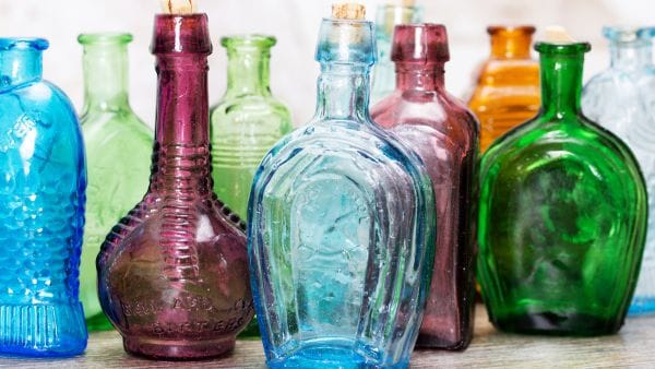 colourful glass bottles on a window ledge